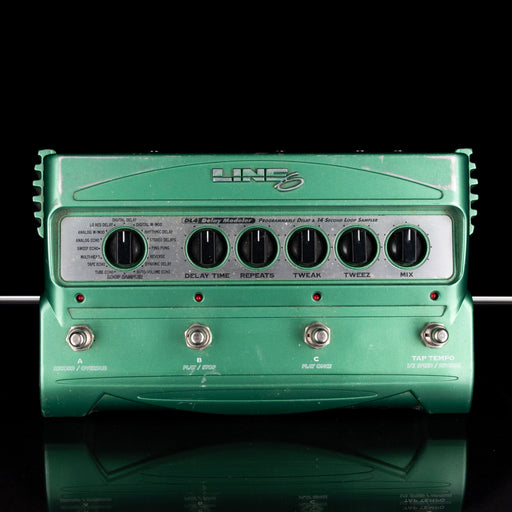 Green guitar effects pedal with 'Line 6' branding on a black background