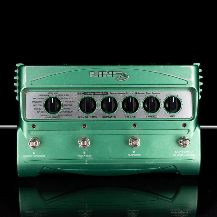 Green guitar effects pedal with 'Line 6' branding on a black background