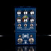 Blue guitar effects pedal with multiple knobs and switches on a black background