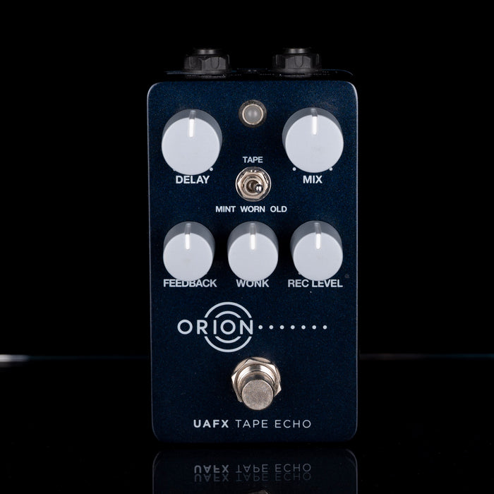 Orion UAFX Tape Echo guitar effects pedal on a black background