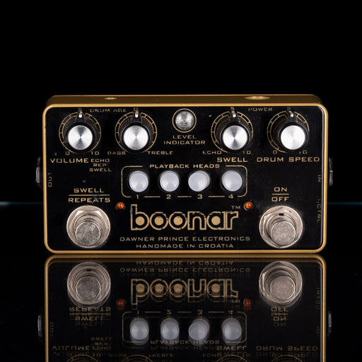 Guitar effects pedal with 'boonar' branding on a reflective surface.
