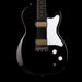 Black electric guitar with a white pickguard on a black background