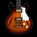 Electric guitar with a sunburst finish on a black background