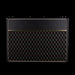 Black guitar amplifier with diamond pattern on a black background