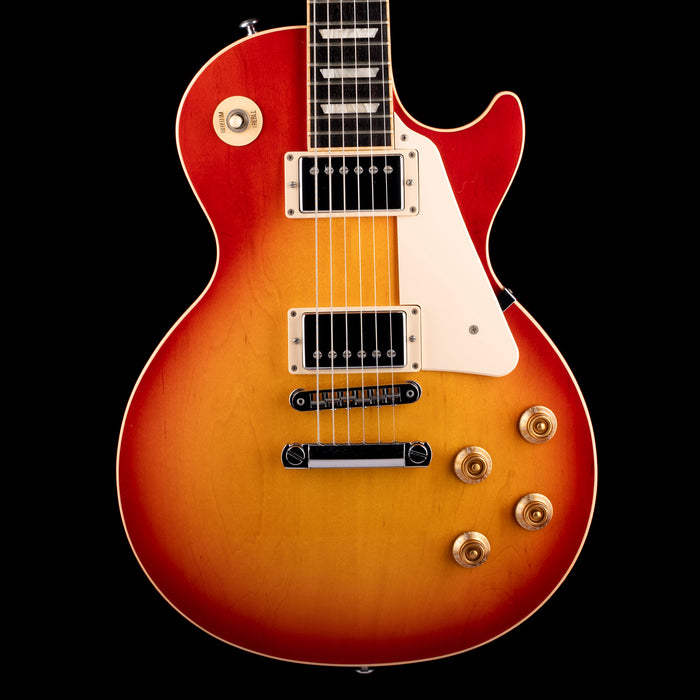 Electric guitar with a sunburst finish on a black background