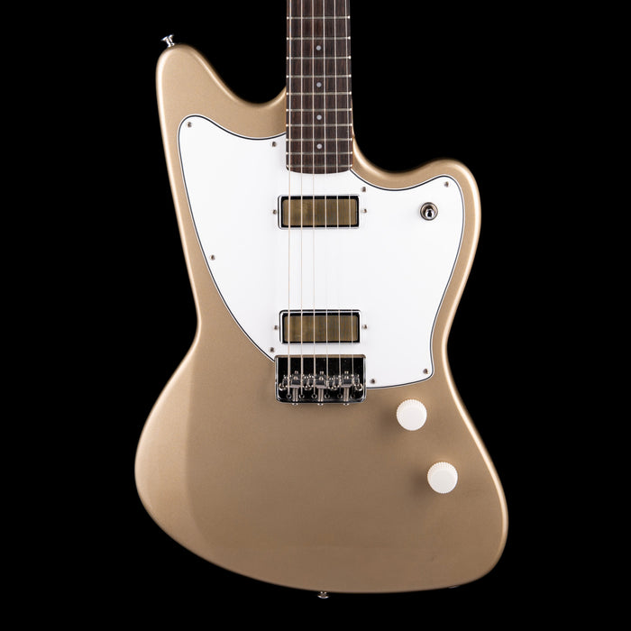 Beige electric guitar with a white pickguard on a black background