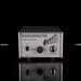 Rangemaster treble booster guitar effect pedal on a reflective surface with a black background