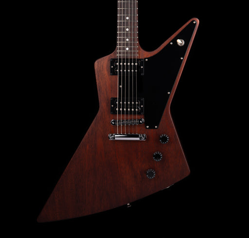 Wooden electric guitar with a unique design on a black background