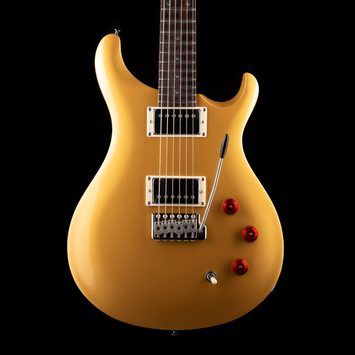 Beige electric guitar on a black background