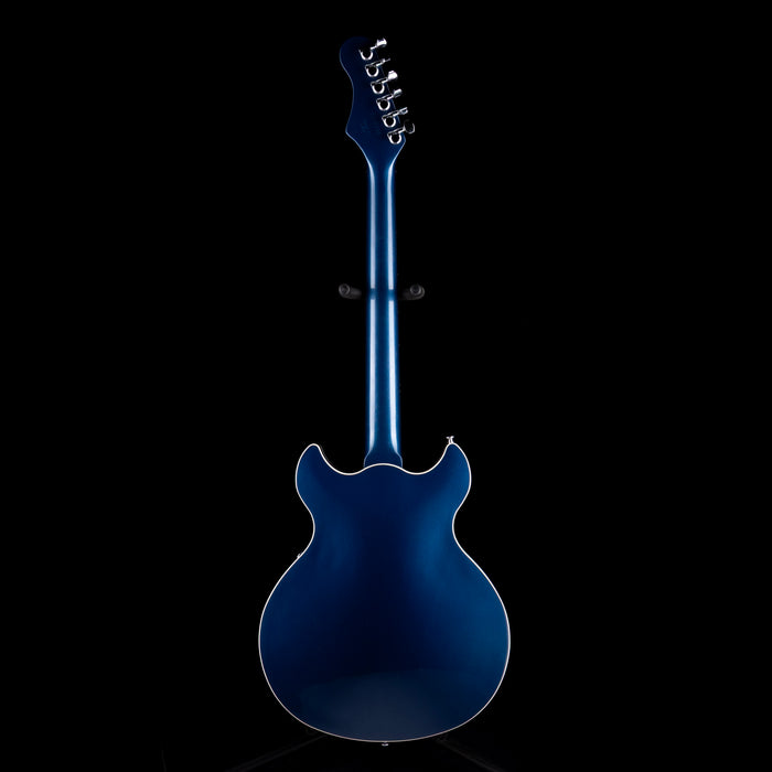 Blue electric guitar on a black background