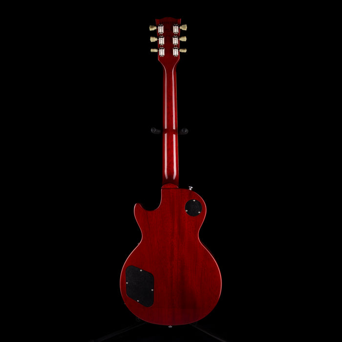 Red electric guitar on a black background