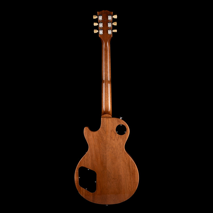 Wooden guitar body on a black background