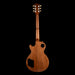 Wooden guitar body on a black background