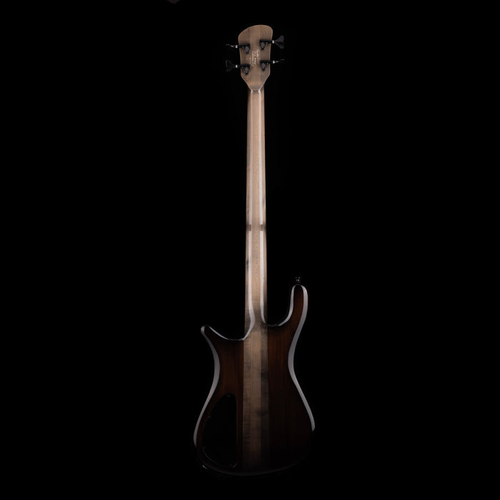 Electric bass guitar with a glossy finish on a black background