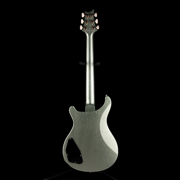 Silver electric guitar on a black background