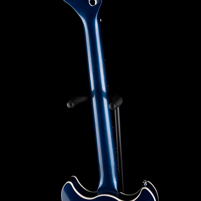 Blue electric guitar on a black background