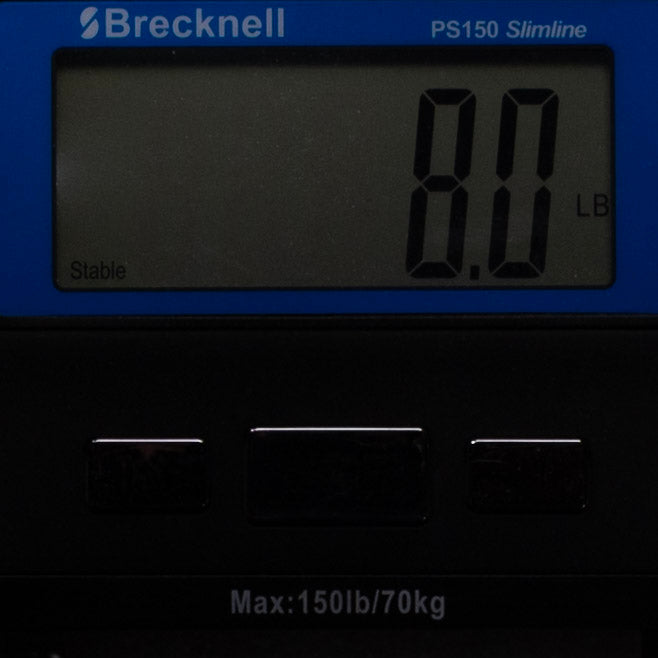 Digital scale with Brecknell branding displaying a weight of 0.0 LB.