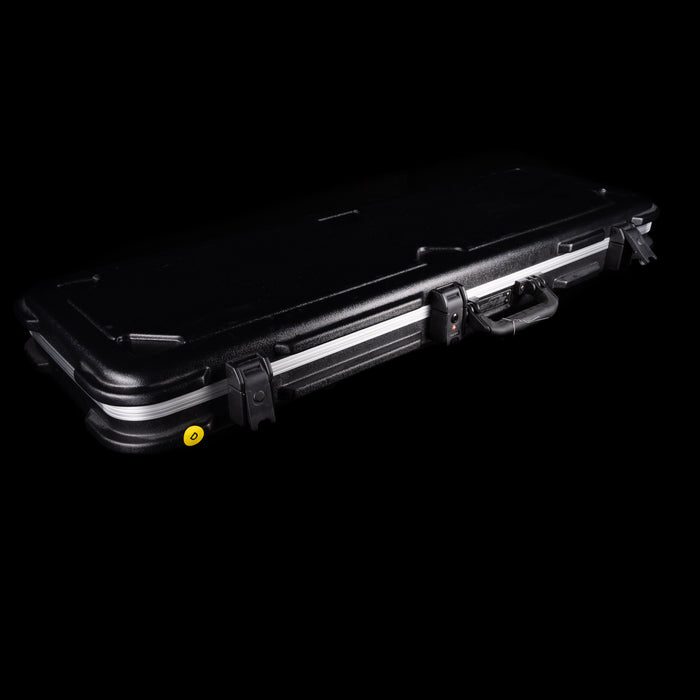 Black hard-shell case with a yellow label on a black background