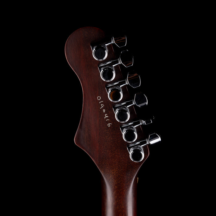 Guitar headstock with tuning pegs on a black background