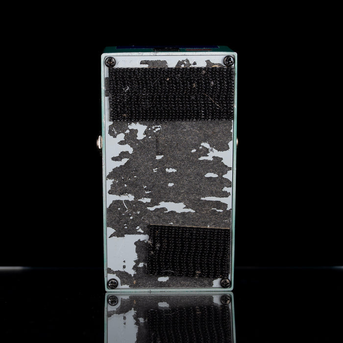 Rectangular electronic device with camouflage pattern on a black background