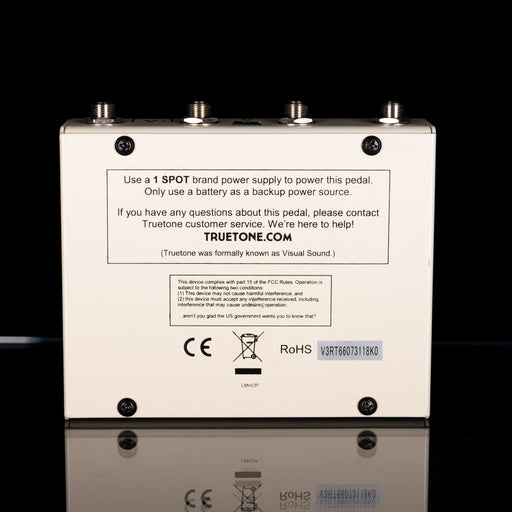 Back view of a guitar effects pedal with branding and technical information on a black background