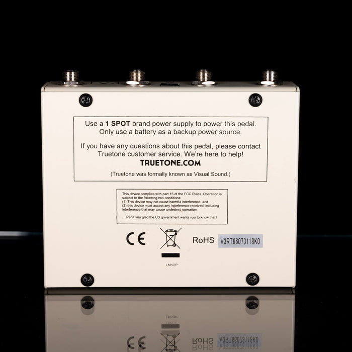 Back view of a guitar effects pedal with branding and technical information on a black background