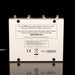 Back view of a guitar effects pedal with branding and technical information on a black background