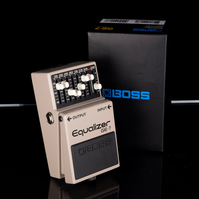 Boss Equalizer GE-7 pedal with packaging on a black background