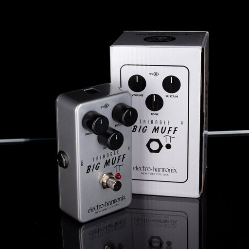 Electro-Harmonix Triangle Big Muff guitar effects pedal on a reflective surface with a black background