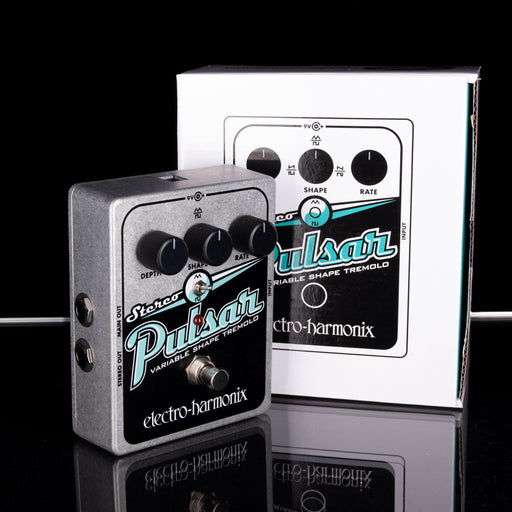 Electro-Harmonix Pulsar variable shape tremolo pedal with packaging on a reflective surface.
