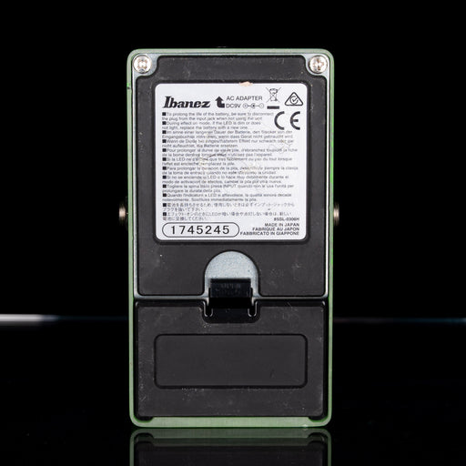 Ibanez guitar pedal with label on a black background