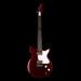 Red electric guitar with a white pickguard on a black background