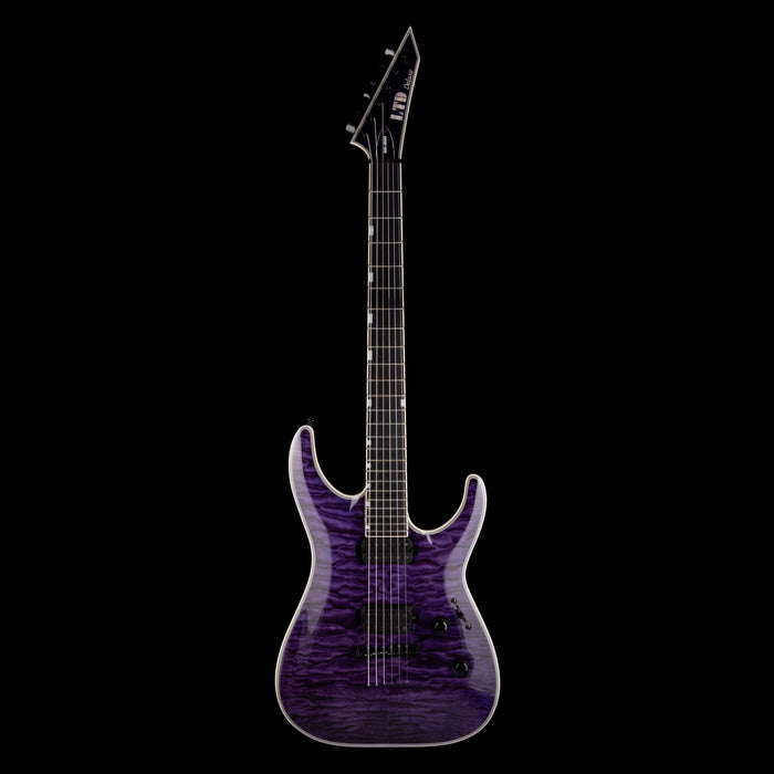 Purple electric guitar on a black background