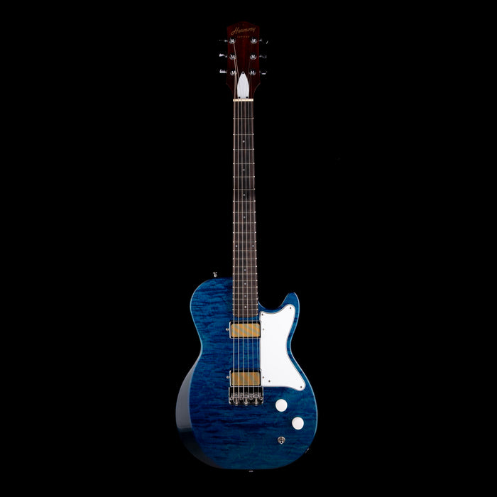 Blue electric guitar with a white pickguard on a black background
