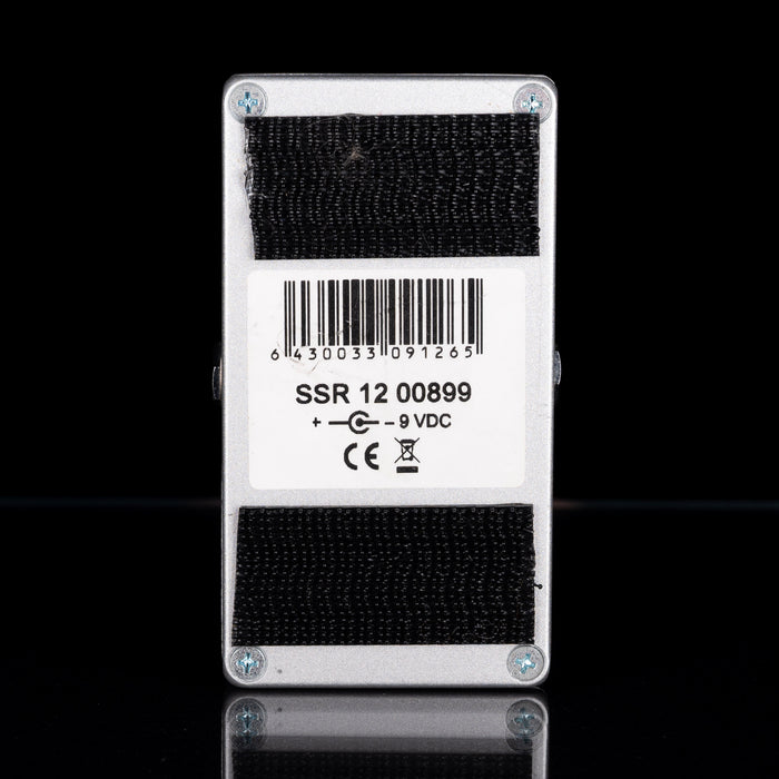 Electronic component with barcode label and text on a black background
