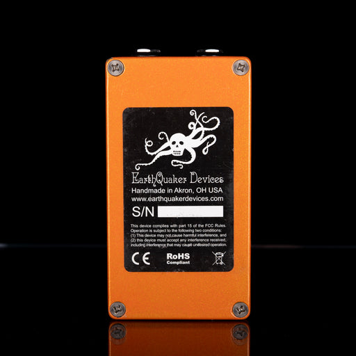 Orange electronic device with EarthQuaker Devices branding on a black background