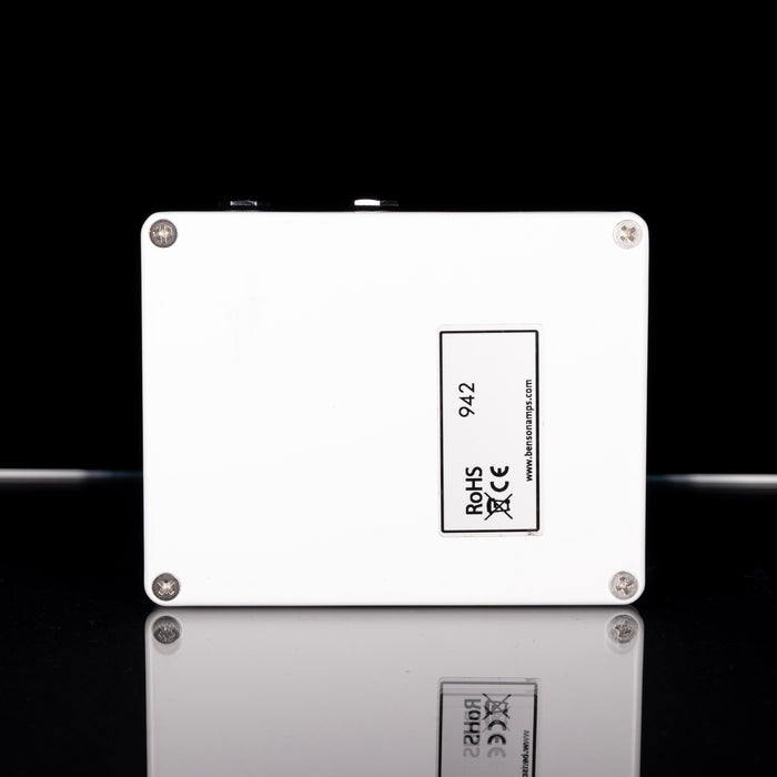 White electronic component with certification labels on a black background