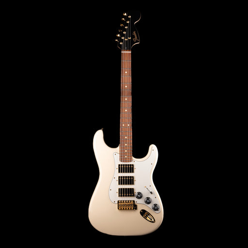 Beige electric guitar on a black background