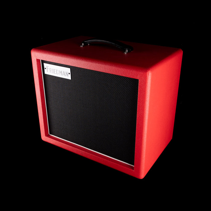 Red guitar amplifier with a black speaker on a white background