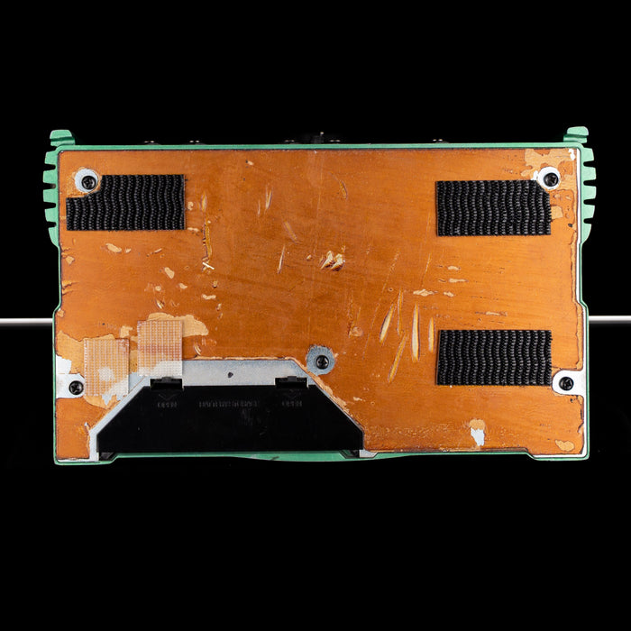 Back view of a electronic device with a metallic finish on a black background