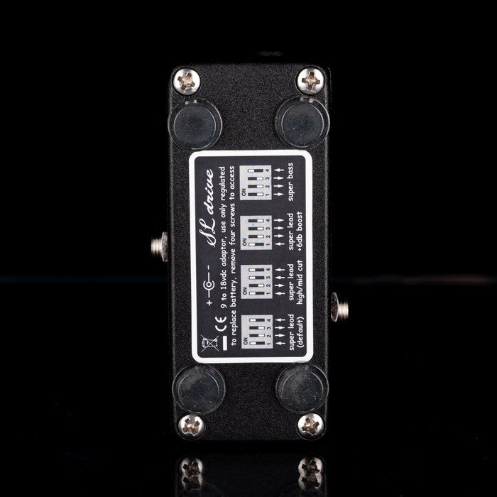 Guitar effects pedal with control panel on a black background