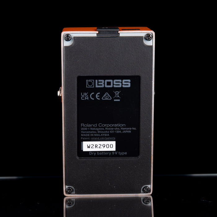 Back view of a Boss guitar pedal with branding and technical details.