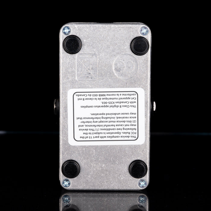 Metallic device with a label on a black background