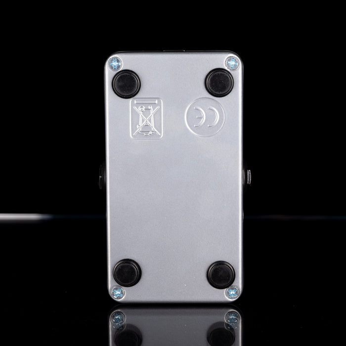 Metallic device with screws on a black background