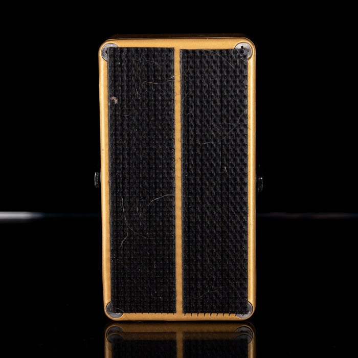 Small guitar amplifier with textured surface on a black background