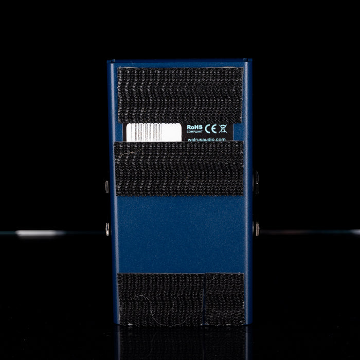 Blue electronic device with textured surface and visible branding on a black background