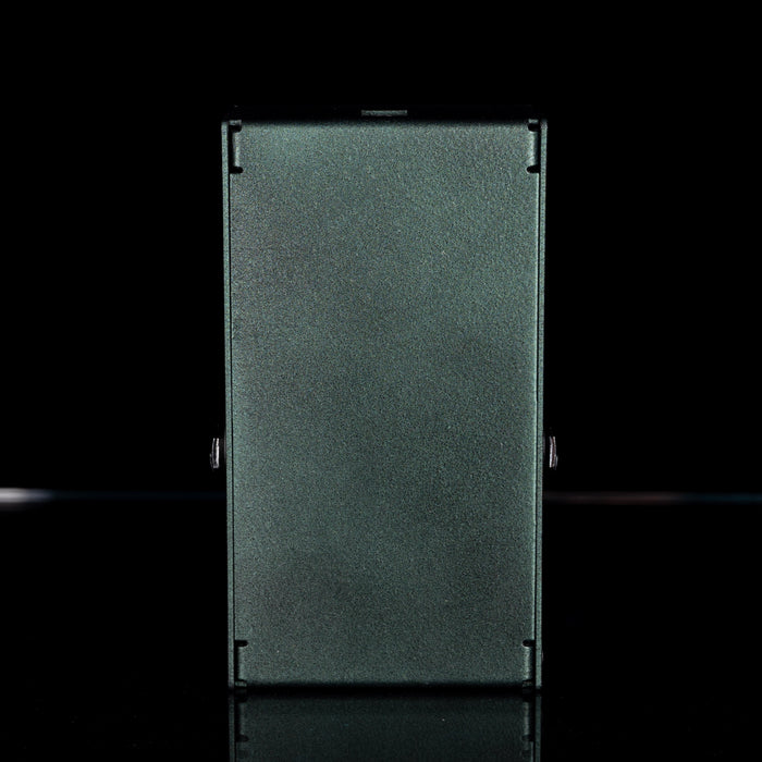 Rectangular metal object on a black background