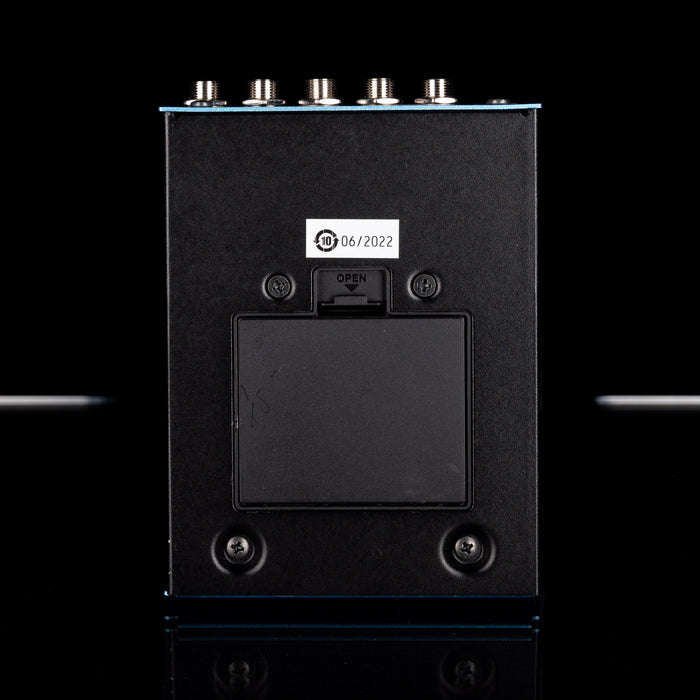 Black electronic device with a label on a black background