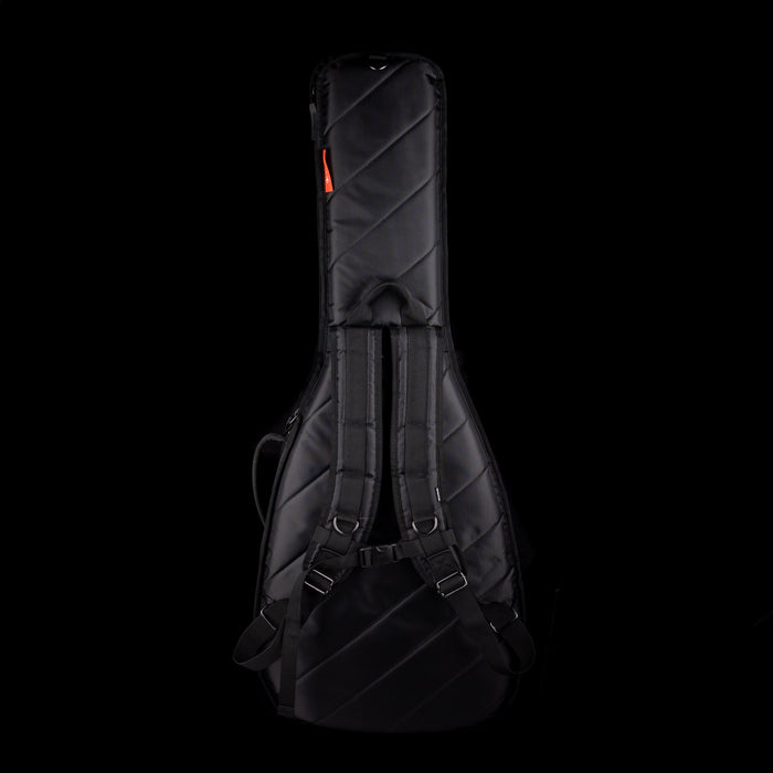 Black guitar case with quilted texture on a black background