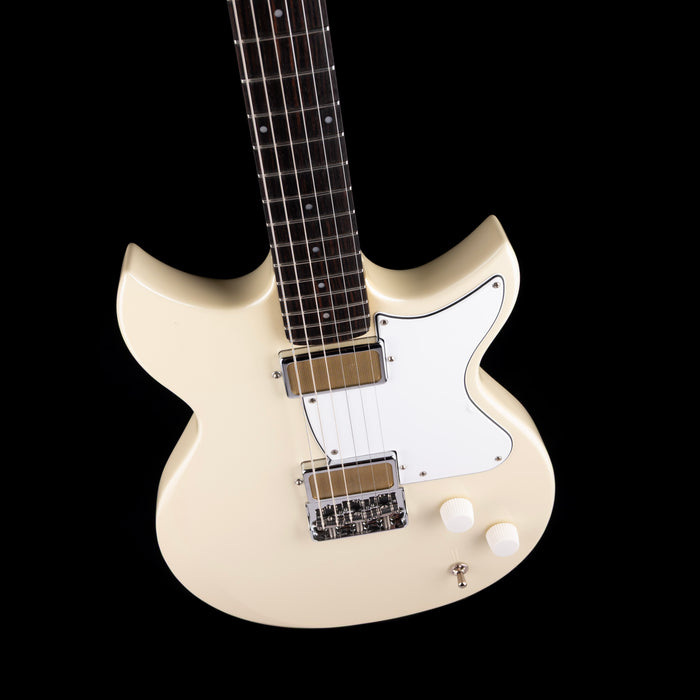 White electric guitar on a black background
